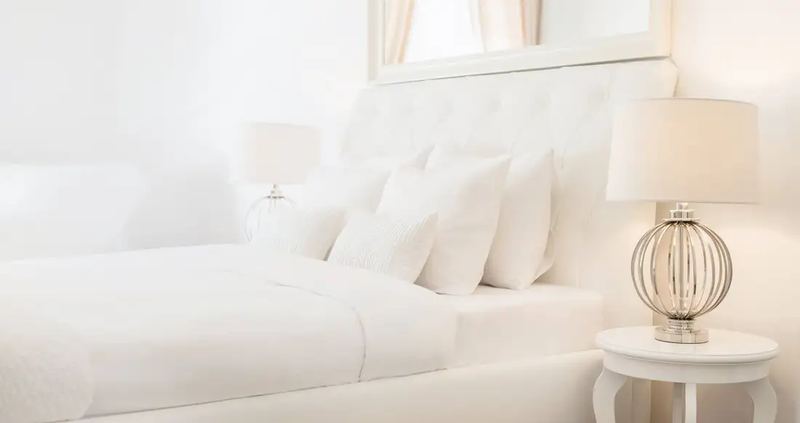 White and very bright bedroom. Shot by Novkov visuals