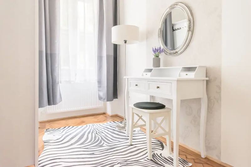 Cozy table bedroom interior by real estate photographer in Budapest