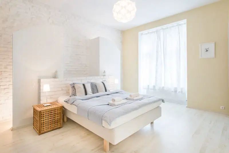 Bright bedroom interior by interior photographer in Budapest