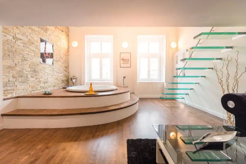 Warm living room with a jacuzzi bathtub, by Interior photographer Budapest