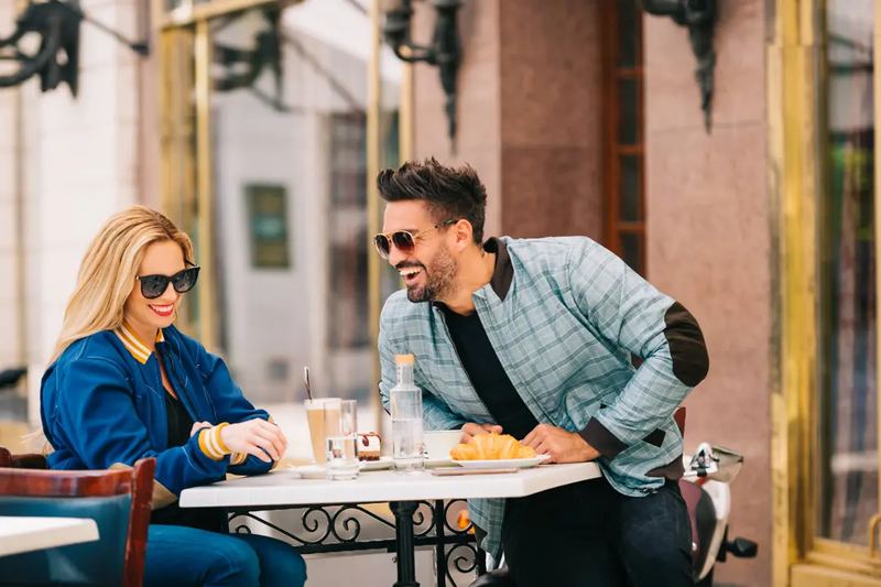 Man and a Woman in Jackets Laughing - Lifestyle Product Photography by Novkov Visuals