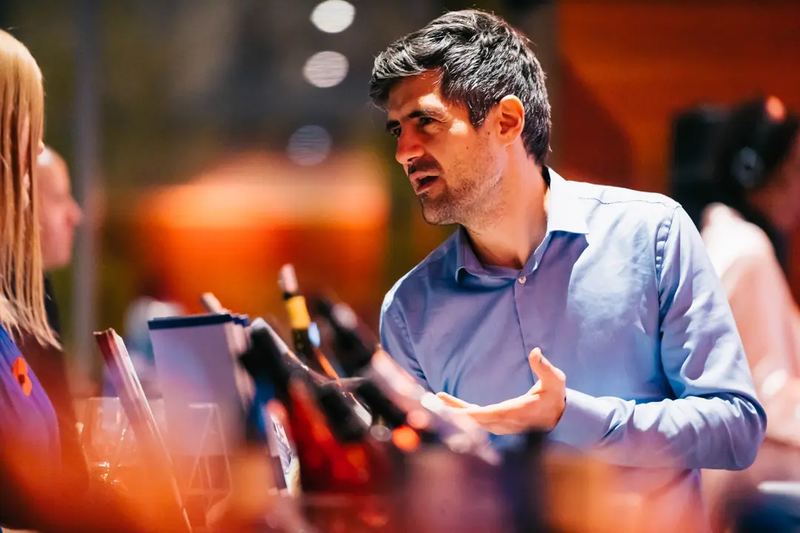 Businessman, discussing whines at a wine tasting event