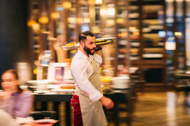 A waiter serving in motion at a hotel Kempinski Budapest