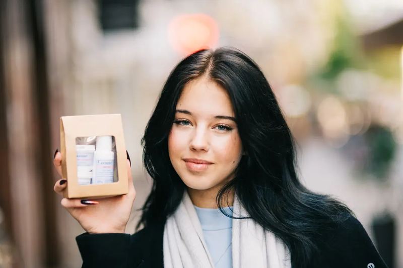 A teenager showing facial cosmetics