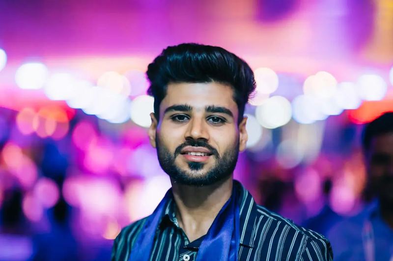 An Indian businessman at a night party in Budapest on a cruising ship
