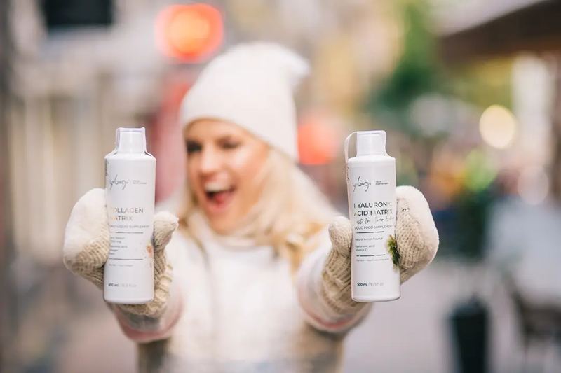 A happy lady showing cosmetics