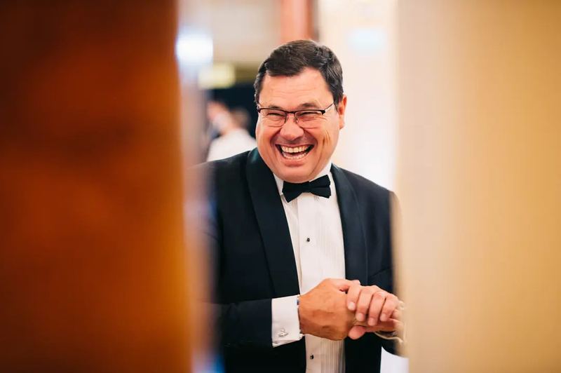 Businessman smiling at a business gala event in Budapest